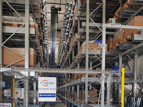 stacker crane aisle — manometal warehouse